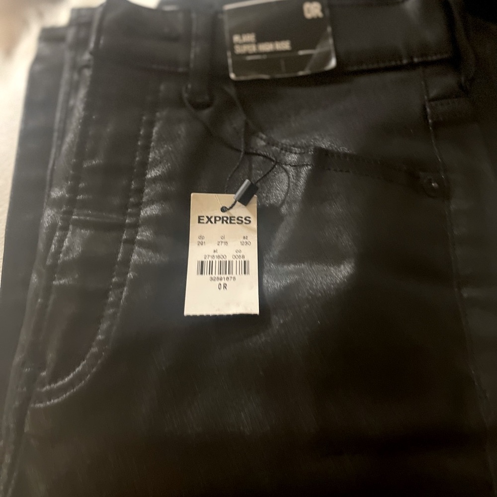 Black pair of faux leather flare Express jeans, NWT, size 0R.